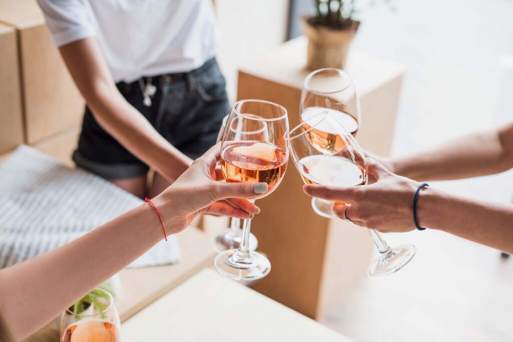 cropped-view-of-women-clinking-with-wineglasses-wi-CUNEAKK.jpg