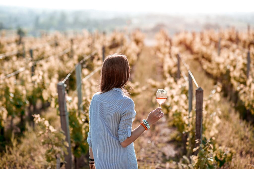 woman-tasting-wine-outdoors-9AXZHPJ.jpg